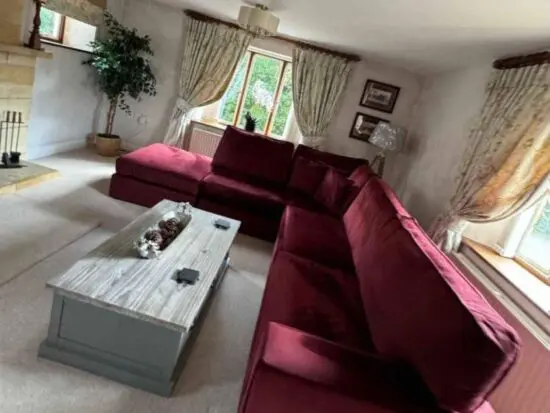 Luxury Velvet maroon double pull out spring sofa bed on legs.