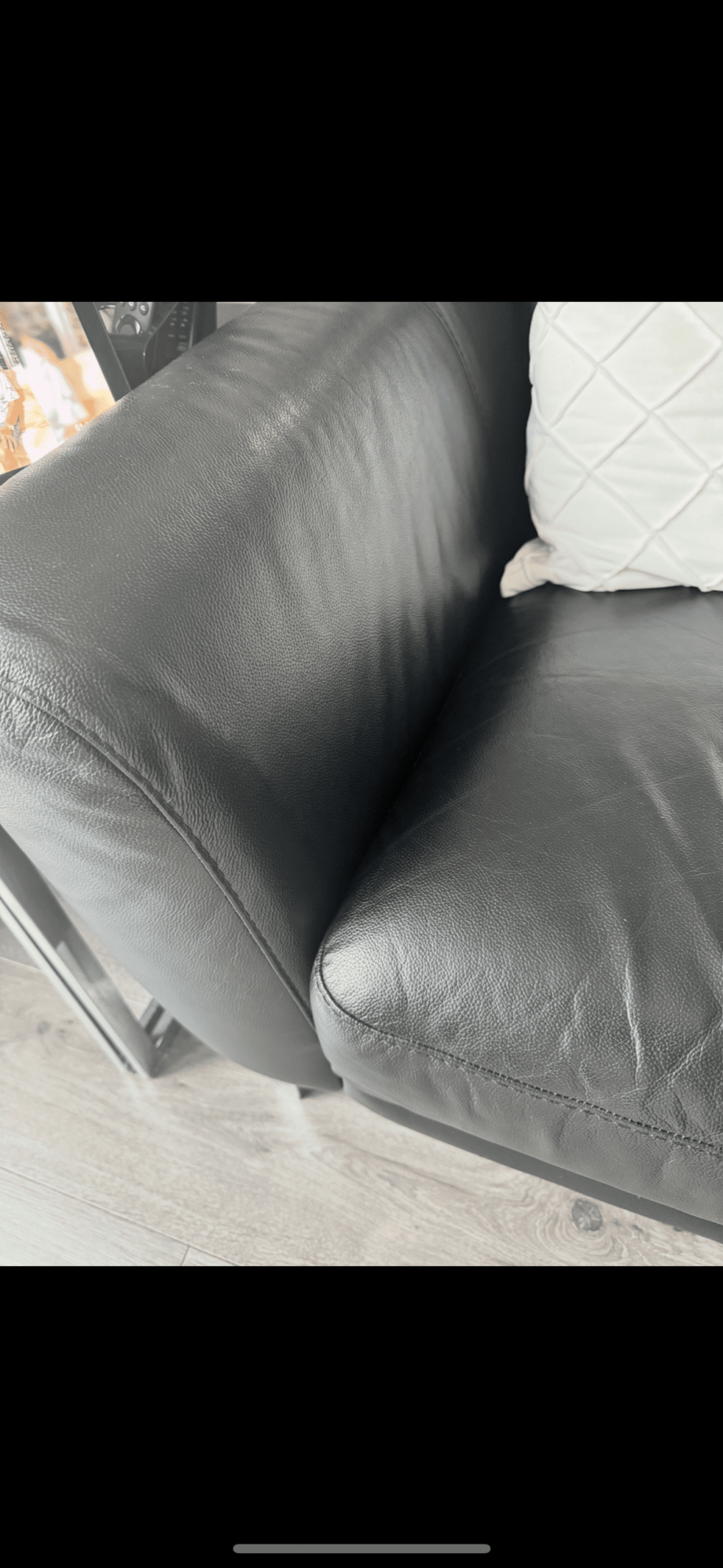 2 black leather sofas with silver feet from DFS