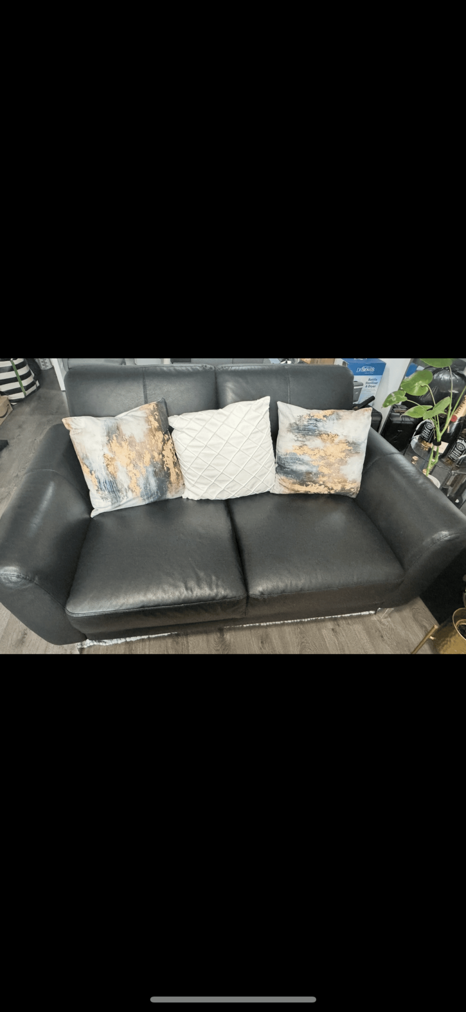 2 black leather sofas with silver feet from DFS