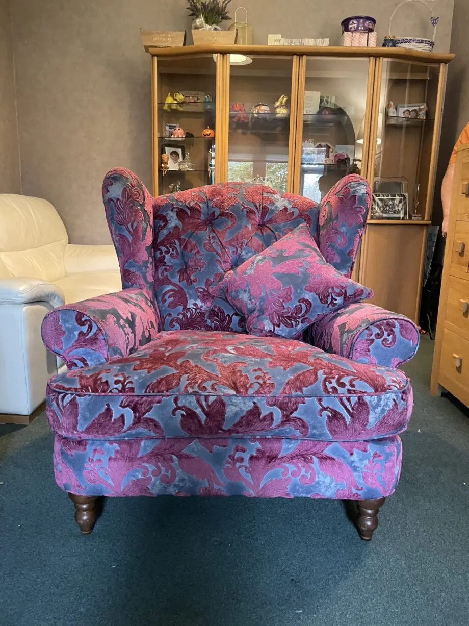 Sofology Liherte purple and grey fabric wingback style chair.