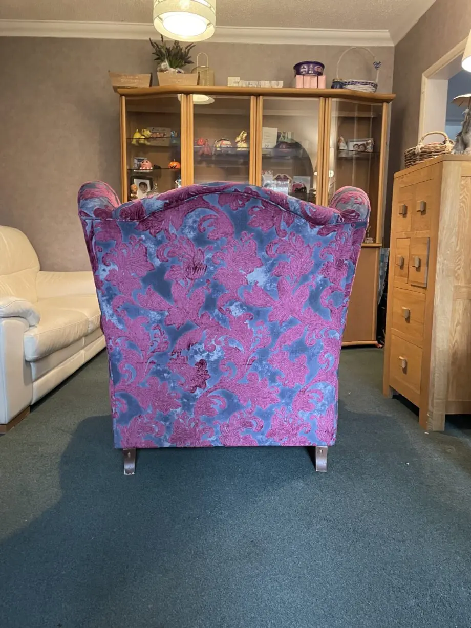 Sofology Liherte purple and grey fabric wingback style chair.