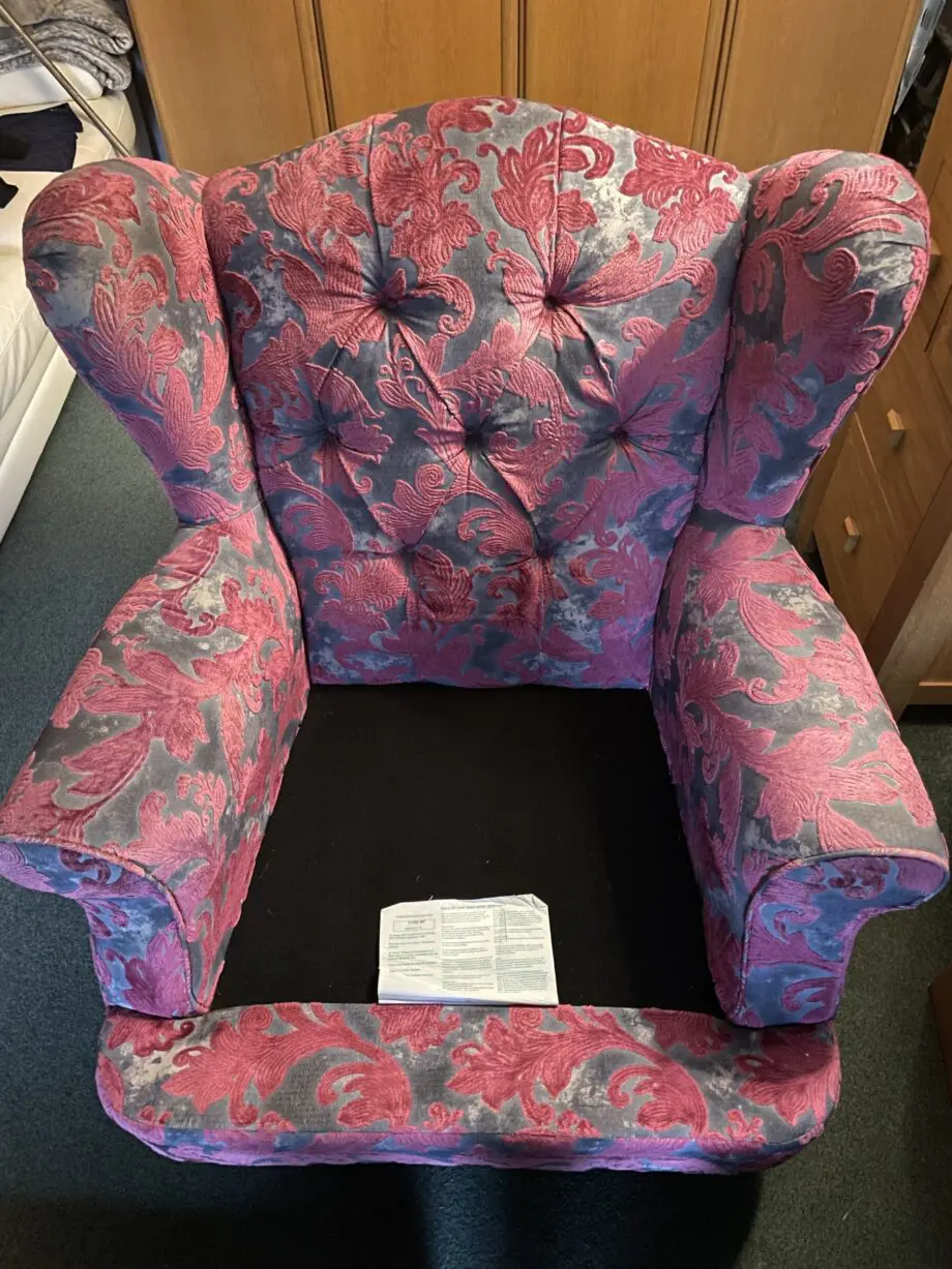 Sofology Liherte purple and grey fabric wingback style chair.