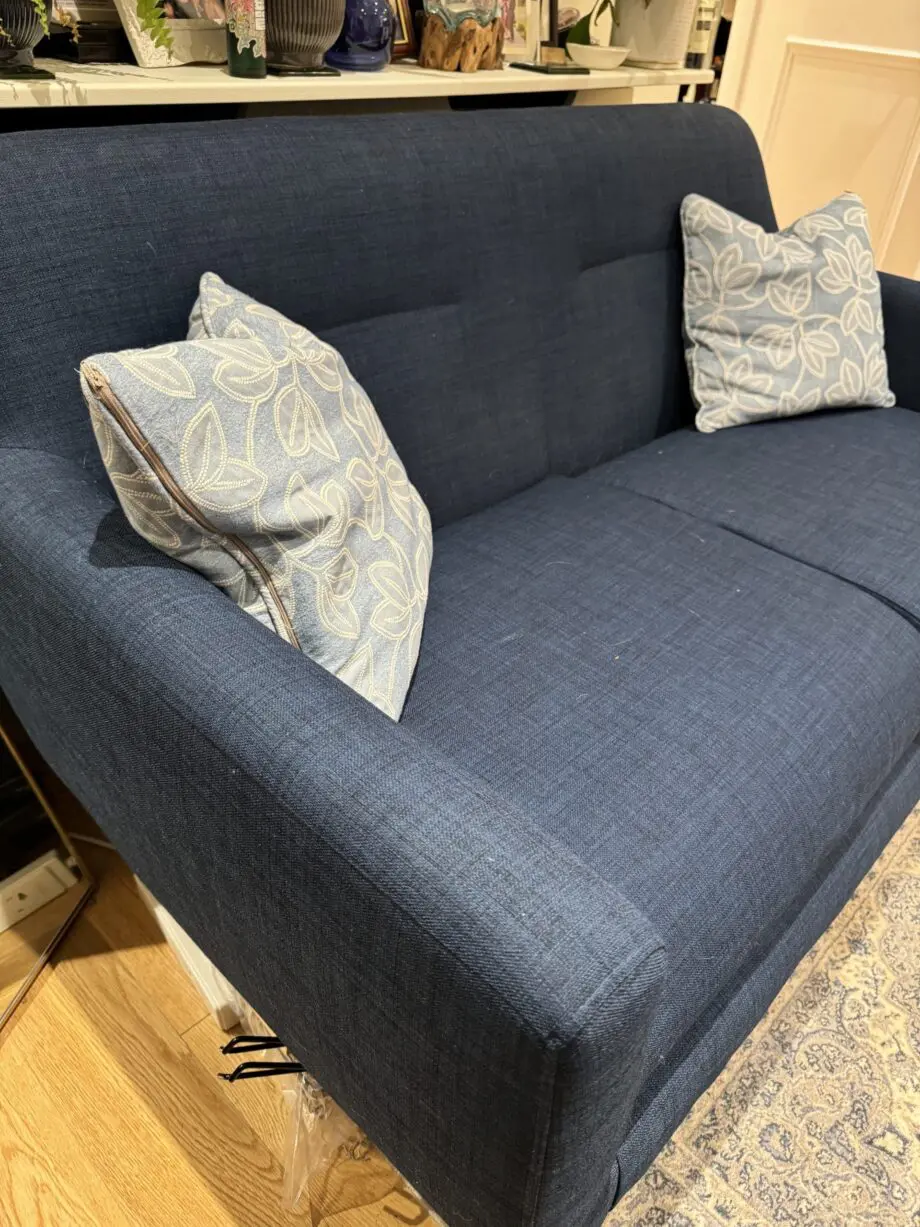 Lightly used small blue sofa
