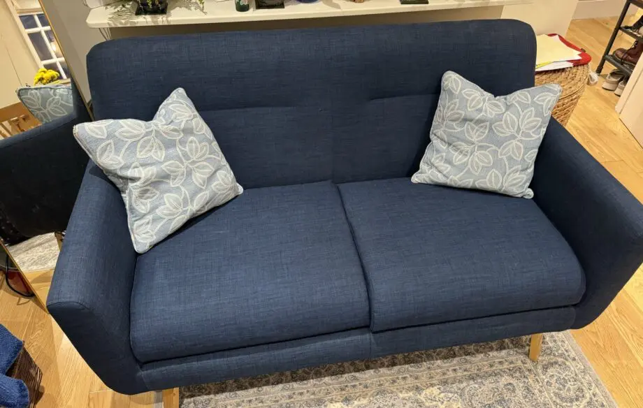 Lightly used small blue sofa