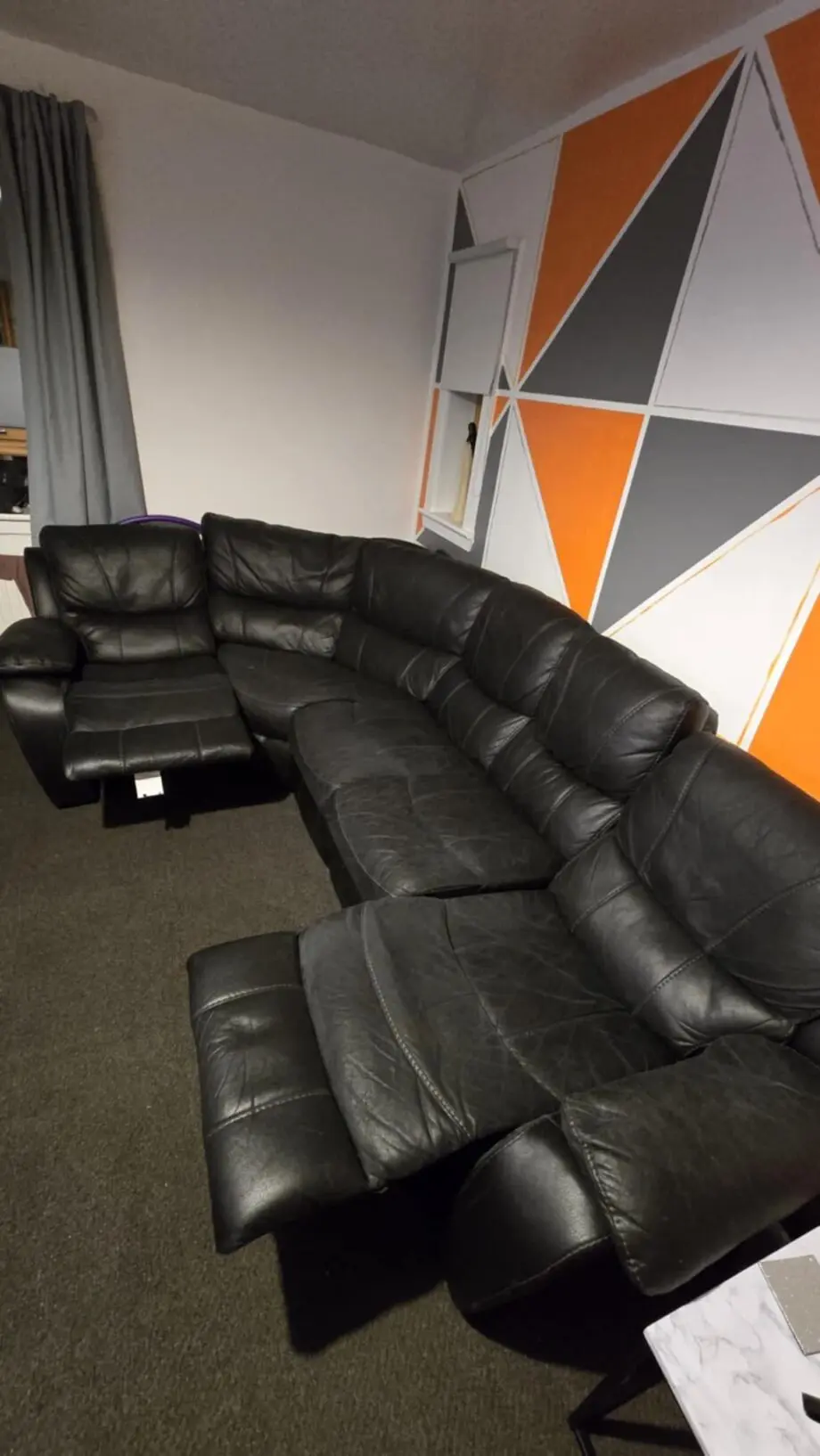 Black curved recliner sofa