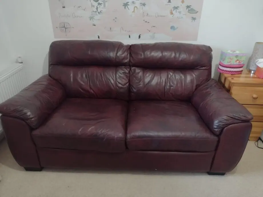 DFS two-seater sofa bed, oxblood leather