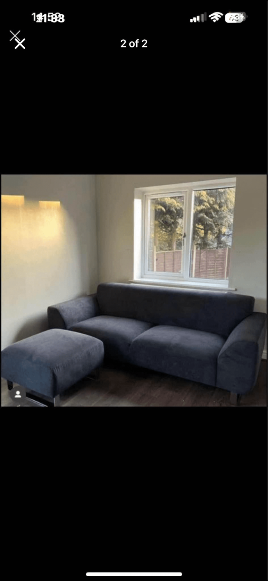 DFS black hardy 2 seater sofa and footstool