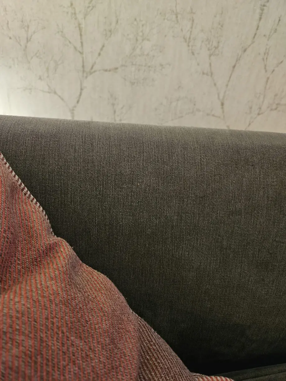 Lovely very clean 2 setter grey sofa with 2 pink/plum cushions