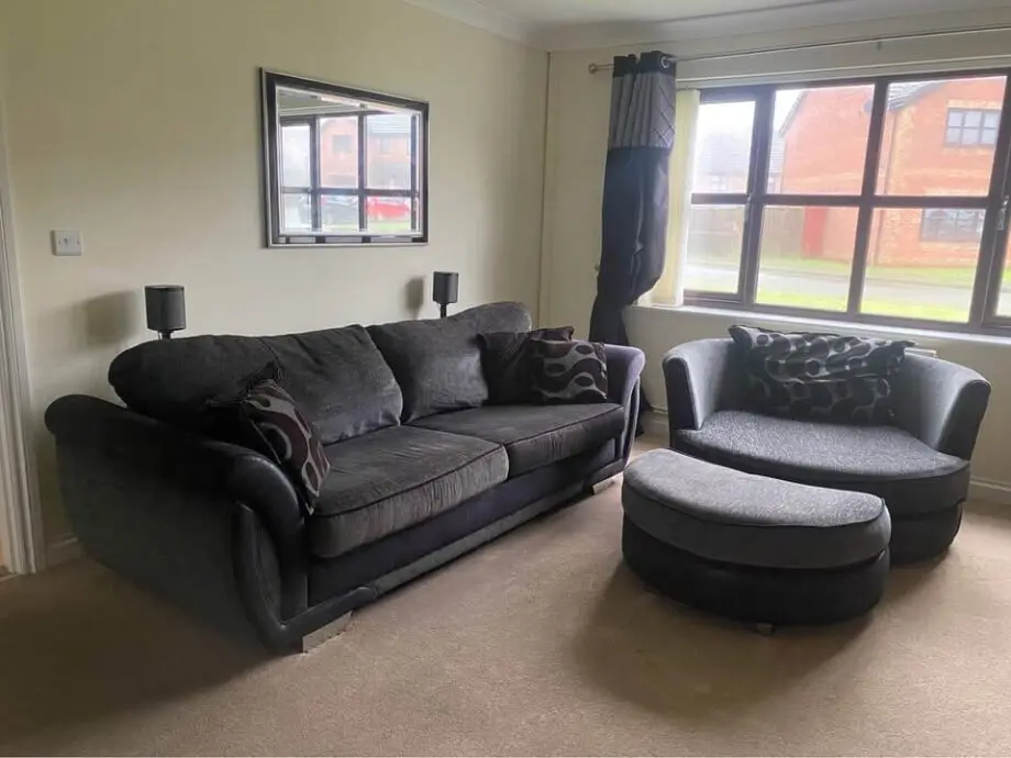 DFS Shannon large black and grey sofa and swivel cuddle chair with footrest