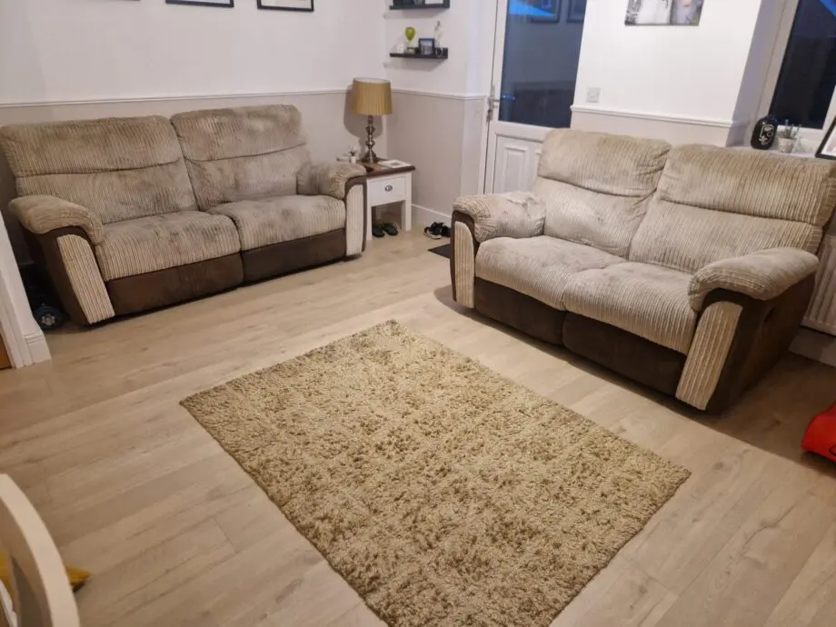 Brown and beige recliner sofas