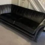 Dark grey velvet style three seater couch - practically brand new