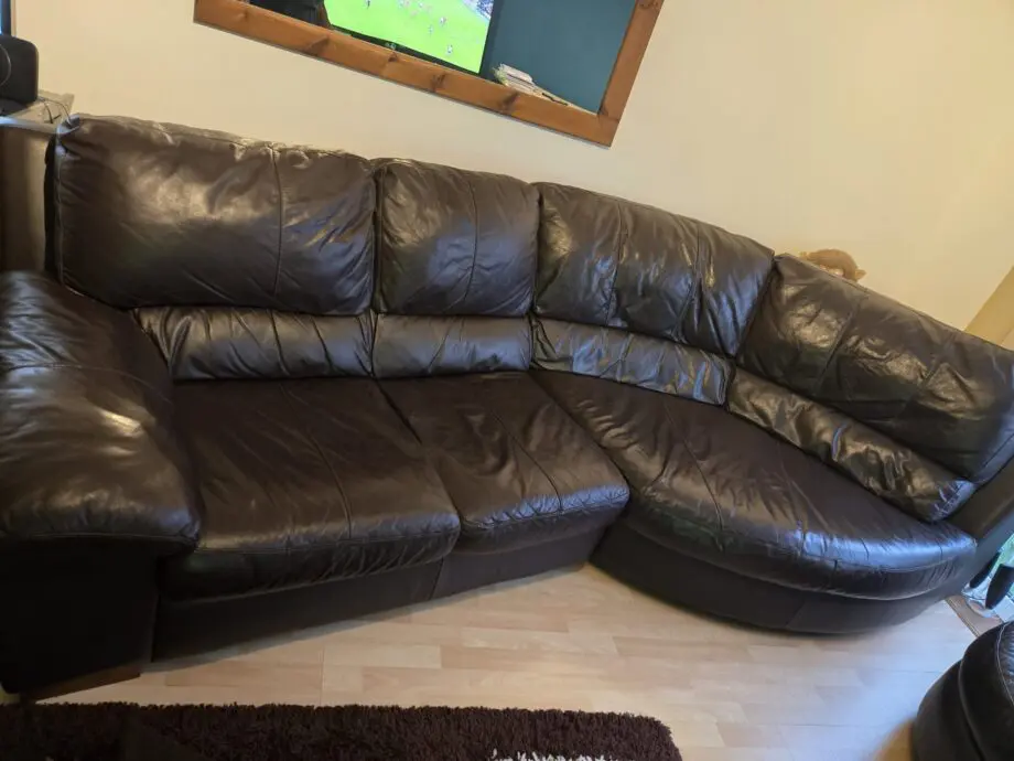 Dark Brown DFS Leather curved Sofa