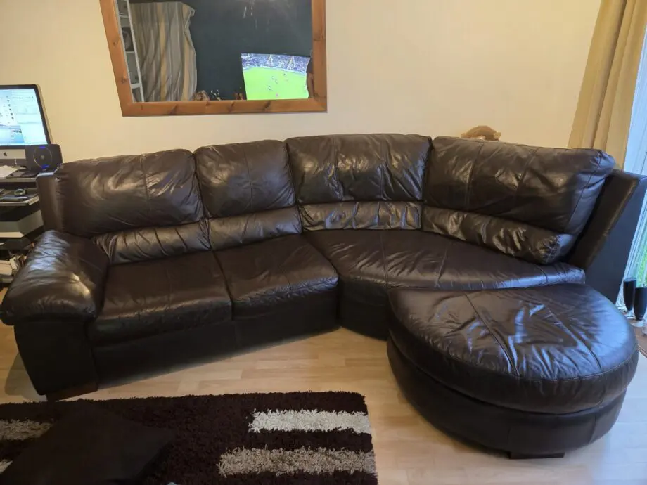 Dark Brown DFS Leather curved Sofa