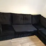 Black plush corner sofa