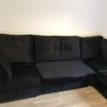 Black plush corner sofa