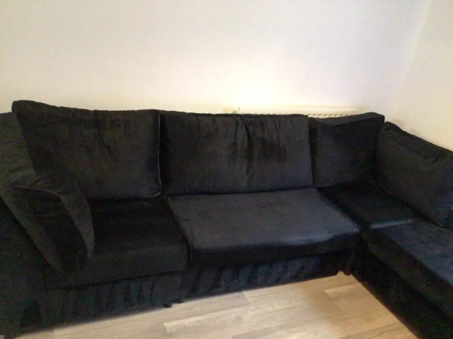Black plush corner sofa