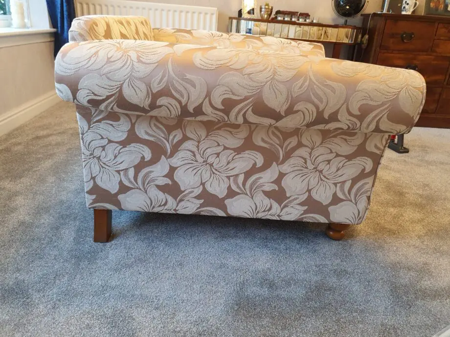 Gold and beige floral armchair