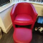 2 x Red armchairs with 2 foot stools. Great offer