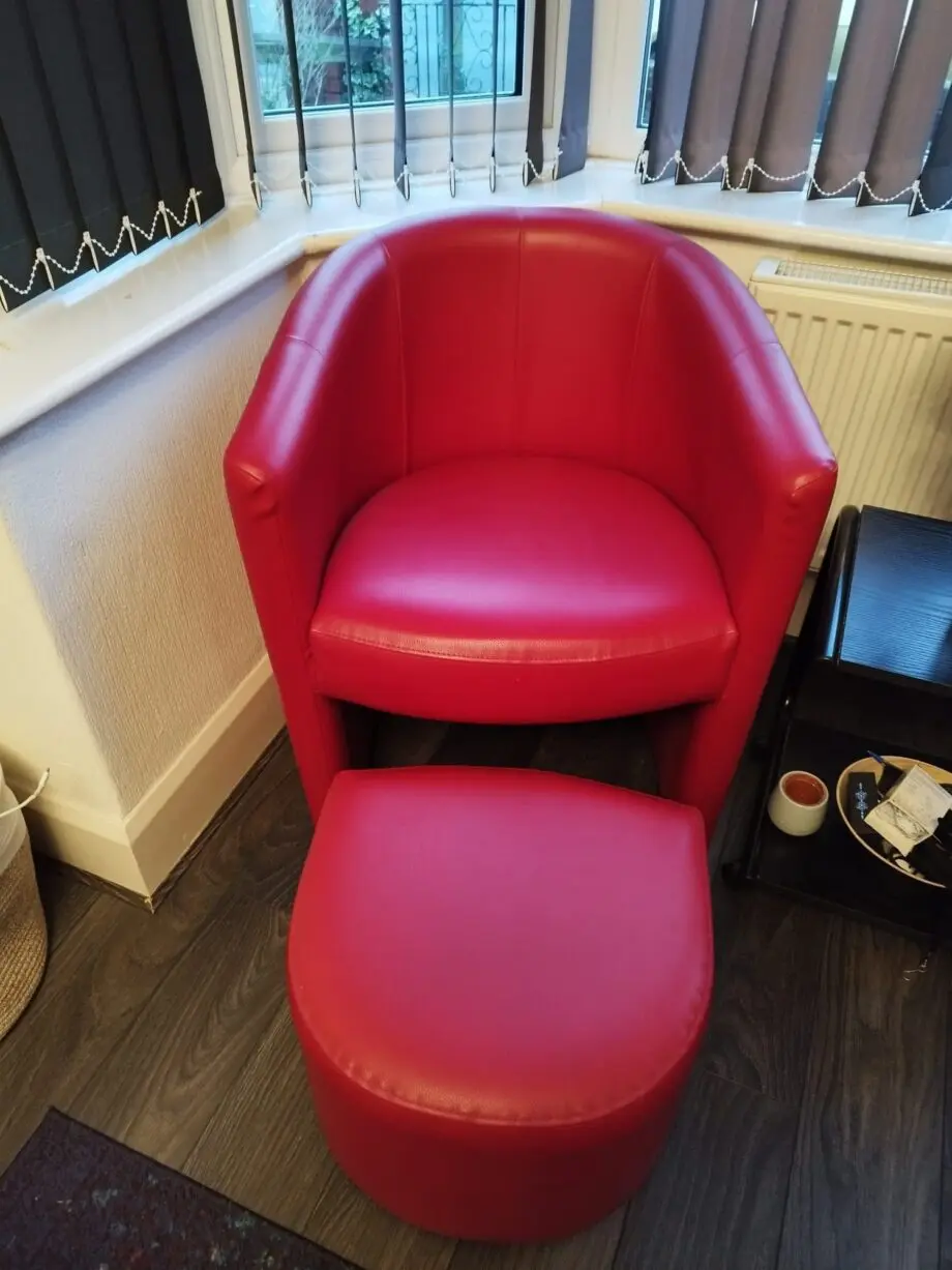2 x Red armchairs with 2 foot stools. Great offer