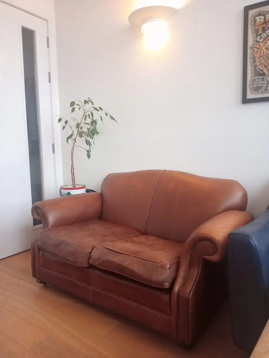 Laura Ashley pair of brown clubman style two seater sofas