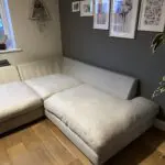 Corner sofa, accent chair and round footstool.