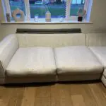 Corner sofa, accent chair and round footstool.