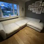 Corner sofa, accent chair and round footstool.