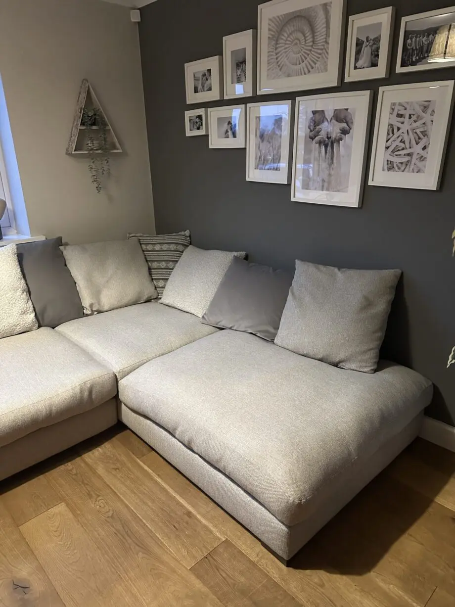 Corner sofa, accent chair and round footstool.