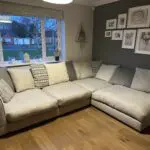 Corner sofa, accent chair and round footstool.