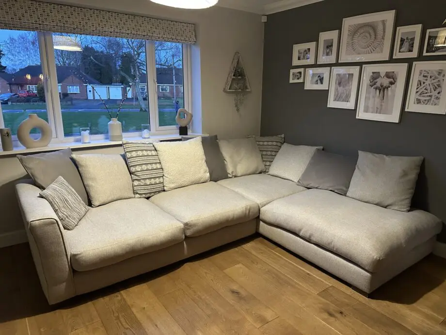 Corner sofa, accent chair and round footstool.