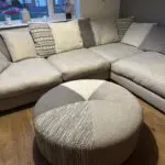 Corner sofa, accent chair and round footstool.