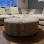 Corner sofa, accent chair and round footstool.