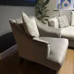 Corner sofa, accent chair and round footstool.