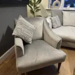 Corner sofa, accent chair and round footstool.