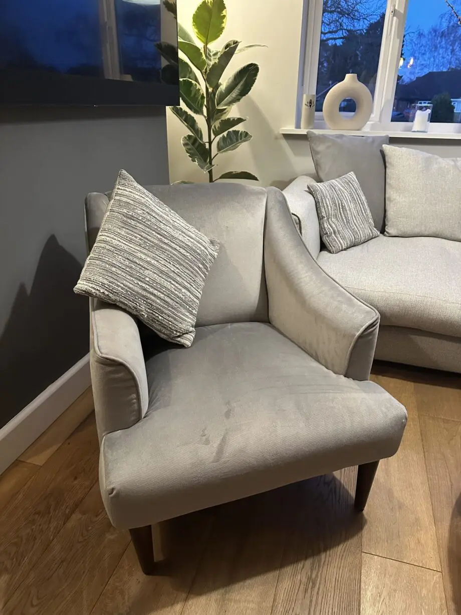 Corner sofa, accent chair and round footstool.