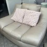 Quality neutral colour leather sofa and matching snuggle chair(Sterling Home)
