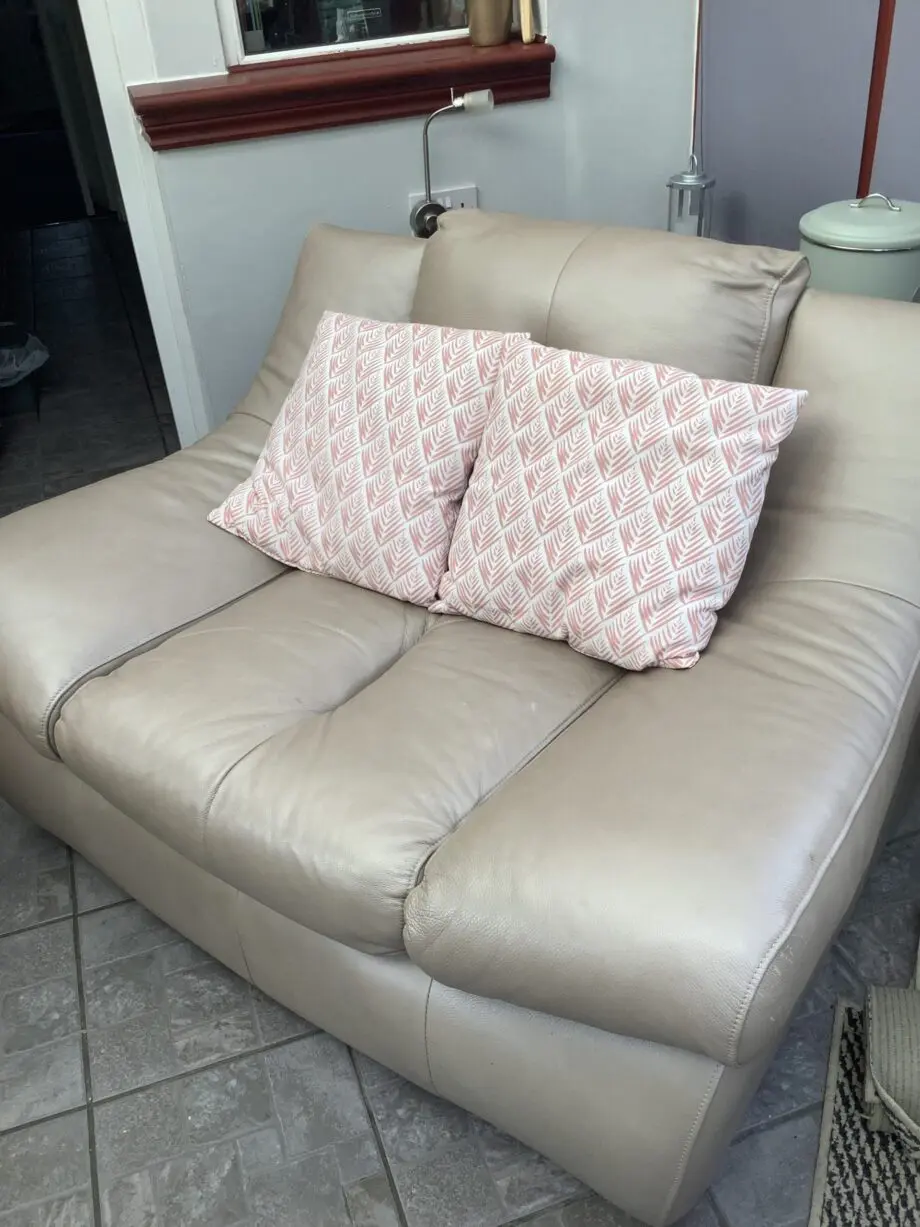 Quality neutral colour leather sofa and matching snuggle chair(Sterling Home)