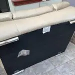 Quality neutral colour leather sofa and matching snuggle chair(Sterling Home)