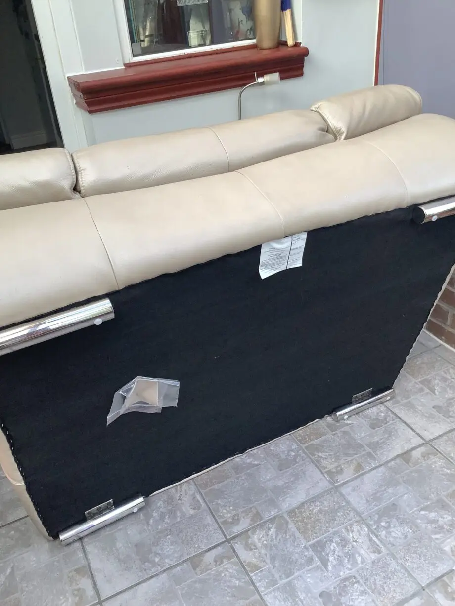 Quality neutral colour leather sofa and matching snuggle chair(Sterling Home)