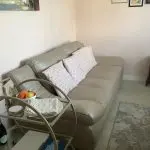 Quality neutral colour leather sofa and matching snuggle chair(Sterling Home)