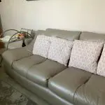 Quality neutral colour leather sofa and matching snuggle chair(Sterling Home)