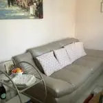 Quality neutral colour leather sofa and matching snuggle chair(Sterling Home)