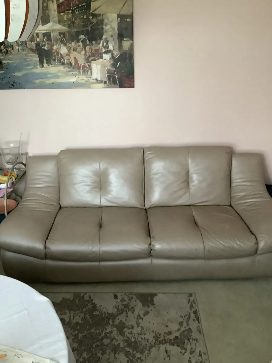 Quality neutral colour leather sofa and matching snuggle chair(Sterling Home)