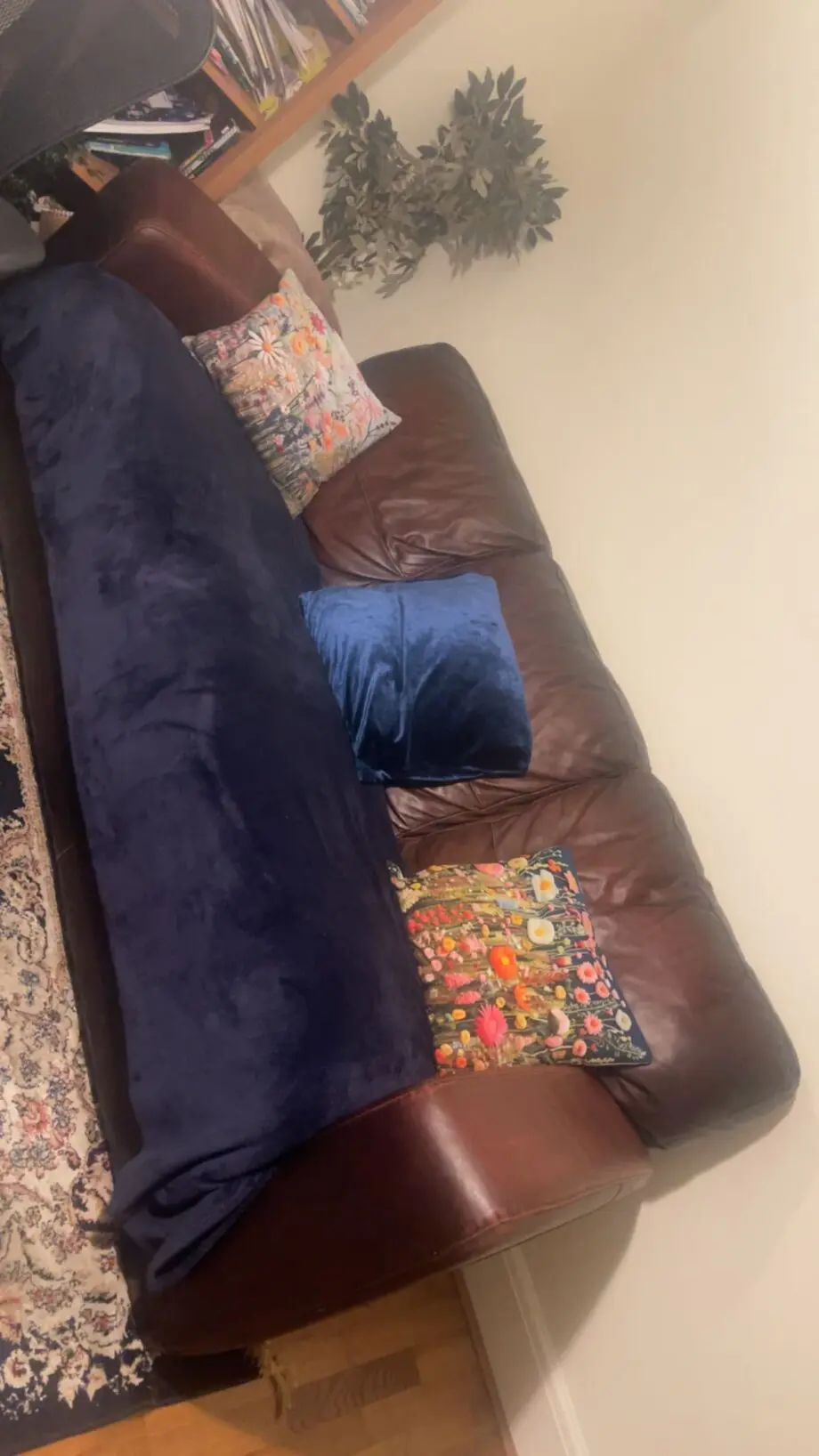 Set of two real leather three-seater sofas with stool
