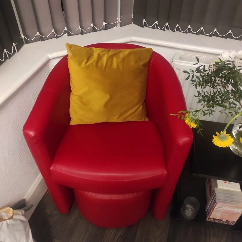 2 x Red armchairs with 2 foot stools. Great offer