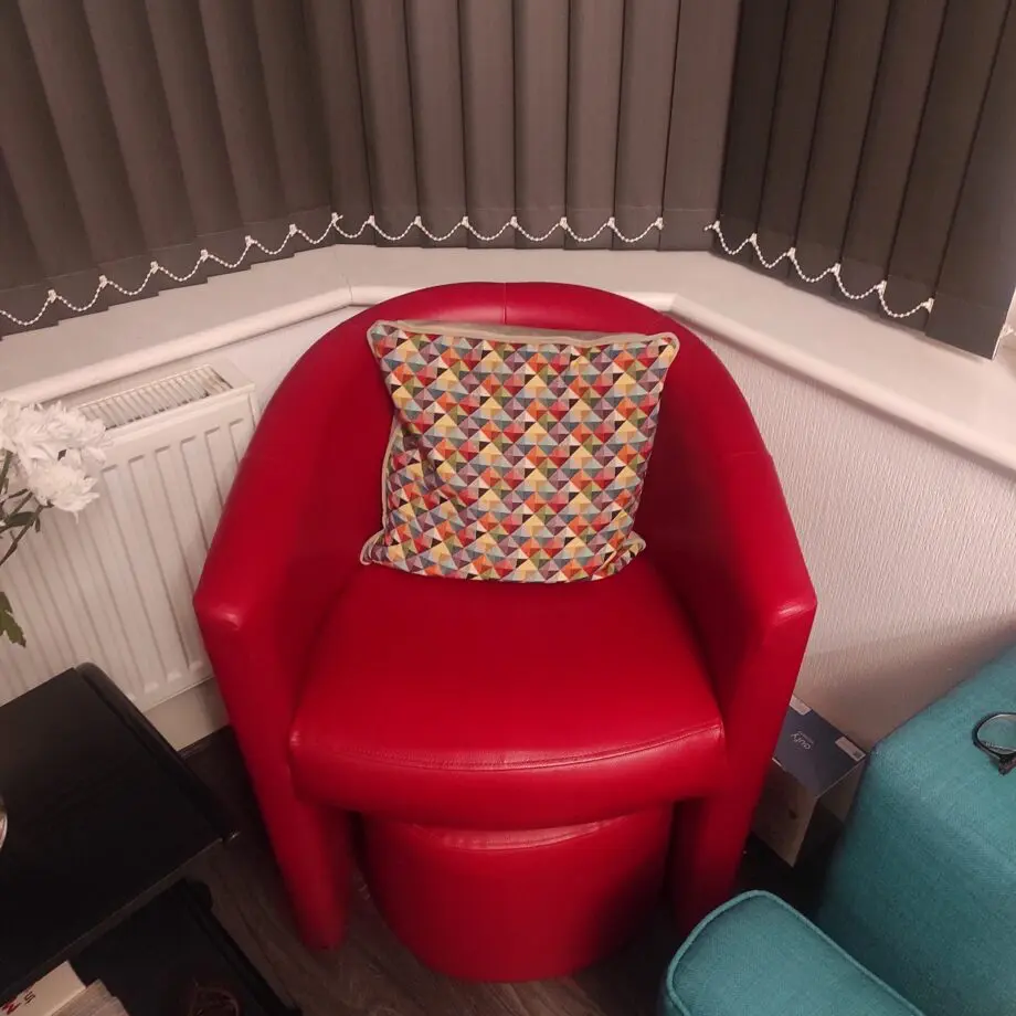 2 x Red armchairs with 2 foot stools. Great offer