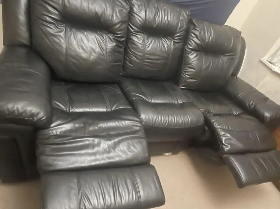 DFS black leather 3 seater sofa with 2 manual recliners