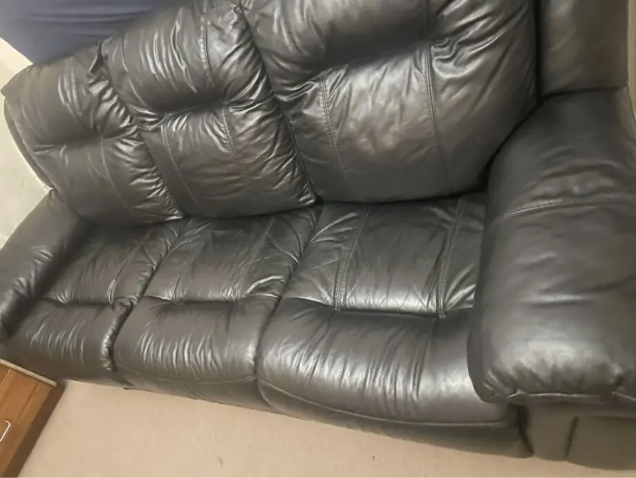 DFS black leather 3 seater sofa with 2 manual recliners