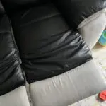 2x 2 seater black leather and grey suede recliner sofas