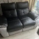 2x 2 seater black leather and grey suede recliner sofas